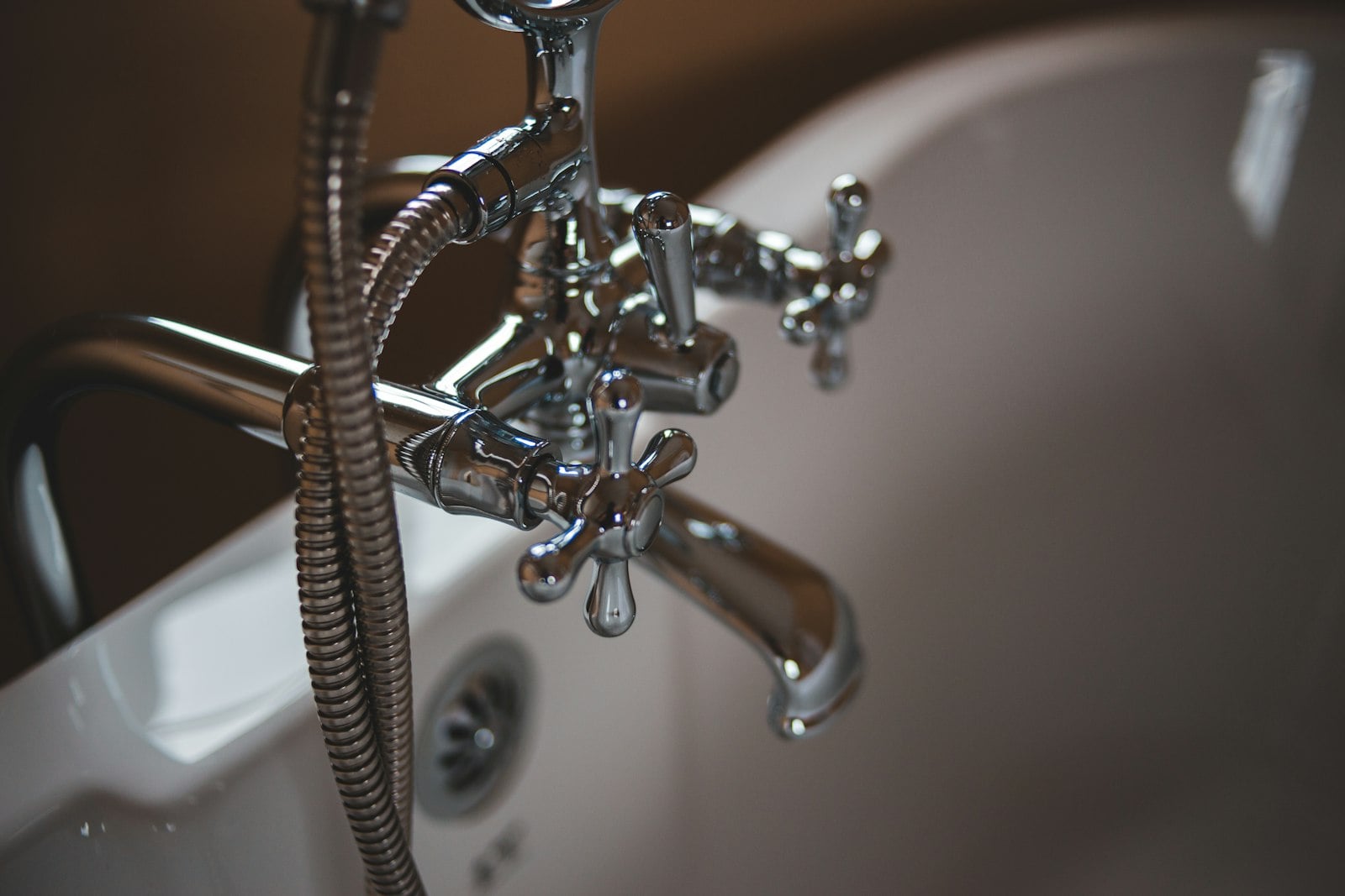 Chrome bathtub faucet and hand shower